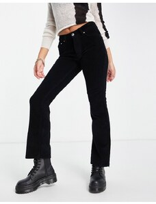 ASOS DESIGN - Jeans a zampa a vita bassa in tessuto rigido a coste nero