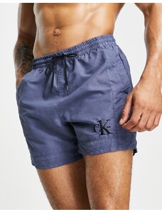 Calvin Klein - Pantaloncini da bagno blu navy con icona del logo
