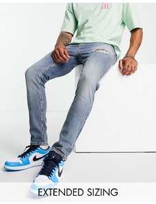 ASOS DESIGN - Jeans skinny lavaggio medio con strappi-Blu