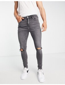 ASOS DESIGN Plus - Jeans spray-on super elasticizzati nero slavato con strappi sulle ginocchia