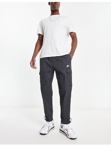 Nike - Pantaloni grigio scuro con grafica del logo ripetuta