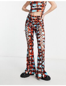 Annorlunda - Pantaloni a zampa con stampa in rete e a quadri tie-dye multicolore in coordinato