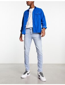 ASOS DESIGN - Jeans skinny blu lavaggio chiaro con strappi sulla coscia