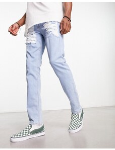 ASOS DESIGN - Jeans skinny blu lavaggio chiaro con strappi vistosi