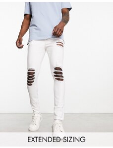 ASOS DESIGN - Jeans spray on power stretch bianchi con strappi vistosi-Bianco