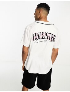 Hollister - Maglia da baseball bianca a maniche corte con logo e fiori di ciliegio stampati sul retro-Bianco