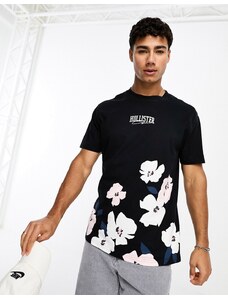 Hollister - T-shirt nera con logo centrale e stampa di fiori di ciliegio-Nero