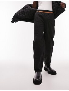 Topman - Pantaloni ampi in nylon nero con elastico arancione fluo in vita