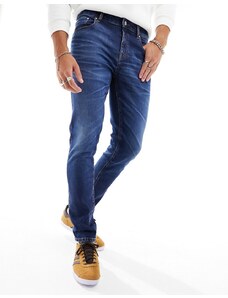 ASOS DESIGN - Jeans skinny blu scuro slavato