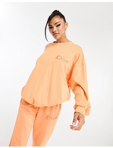 The Couture Club - Felpa arancione oversize con stampa sul retro in coordinato
