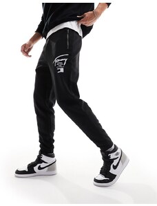 Tommy Jeans - Joggers regular neri con zip e stampa effetto spray-Nero