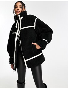 Miss Selfridge - Cappotto oversize stile aviatore in pelliccia sintetica nero
