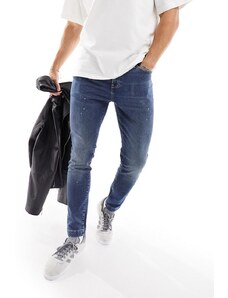 ASOS DESIGN - Jeans skinny blu lavaggio medio con dettagli effetto vernice