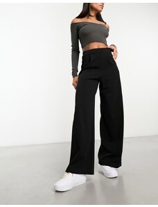 ASOS DESIGN - Pantaloni da abito con fondo ampio neri in jersey-Nero