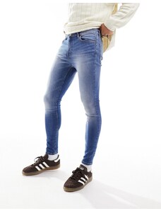 ASOS DESIGN - Jeans spray power stretch lavaggio blu medio