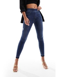 Spanx - Jeans skinny modellanti e con effetto sollevante lavaggio blu medio invecchiato
