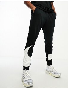 Nike Training - Dri-FIT Energy Swoosh - Joggers affusolati neri con logo-Nero