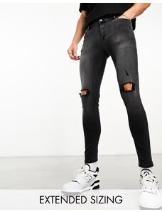 ASOS DESIGN - Jeans effetto spray on in denim power stretch nero slavato con strappi sulle ginocchia