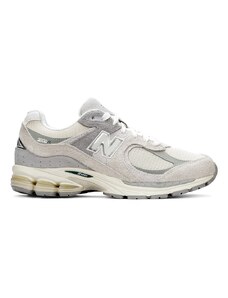 New Balance - 2002 - Sneakers in bianco sporco e grigio