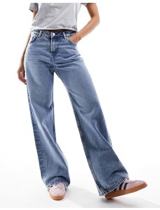 Monki - Naoki - Jeans ampi a vita bassa lavaggio blu medio