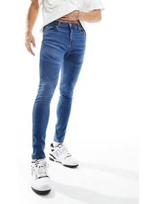 ASOS DESIGN - Jeans spray on super elasticizzati lavaggio scuro vintage-Blu