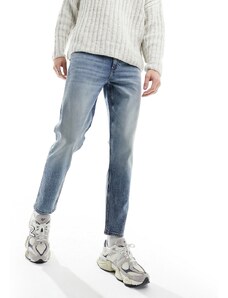 ASOS DESIGN - Jeans stretch affusolati lavaggio blu medio