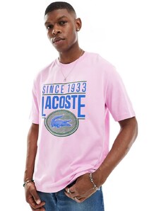 Lacoste - T-shirt rosa con grafica del logo sul davanti