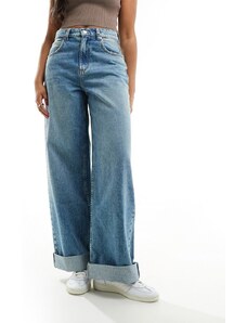 ASOS DESIGN - Jeans larghi blu medio tinto con risvolto ampio