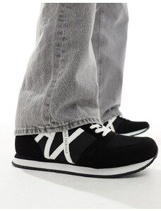 Armani Exchange - Sneakers nere e bianche con logo grande sul lato-Nero