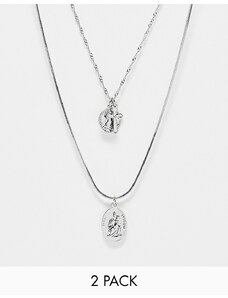 ASOS DESIGN - Confezione da 2 collane con ciondoli a croce e con San Cristoforo color argento