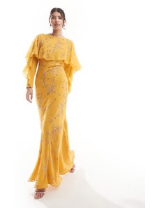 ASOS DESIGN - Modesty - Vestito lungo taglio sbieco a maniche lunghe decorato con volant e dettaglio a mantella color giallo senape