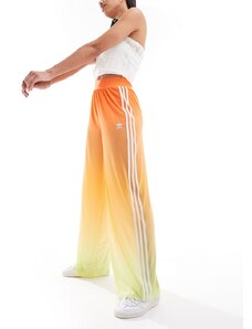 adidas Originals - Pantaloni a fondo ampio in tessuto a rete arancione sfumato