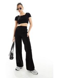 Fashionkilla - Pantaloni con fondo ampio in maglia traforata neri in coordinato-Nero