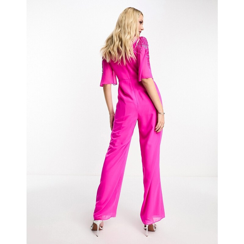 Hope & Ivy - Tuta jumpsuit rosa acceso con scollo profondo decorato
