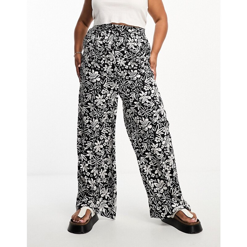 Influence Plus - Pantaloni a fondo ampio monocromatici con stampa a fiori-Nero