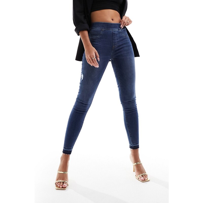 Spanx - Jeans skinny modellanti e con effetto sollevante lavaggio blu medio invecchiato