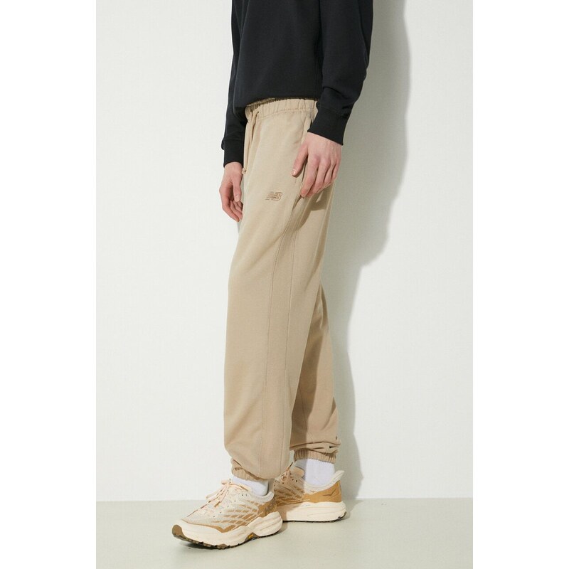 New Balance pantaloni da jogging in cotone colore beige