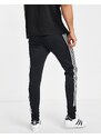 adidas Originals - adicolor - Joggers skinny neri con 3 strisce - BLACK-Nero