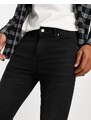 ASOS DESIGN - Jeans in power stretch nero slavato effetto spray