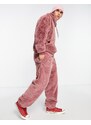 ASOS DESIGN - Joggers oversize in pelliccia sintetica rosa
