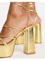 Truffle Collection - Sandali oro metallico con plateau molto alto e fascette