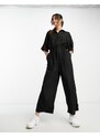 ASOS DESIGN - Tuta jumpsuit stile camicia nera oversize allacciata in vita-Black