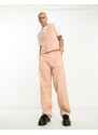 ASOS DESIGN - Giacca da abito senza maniche taglio lungo in lino rosa
