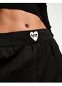 Love Moschino - Pantaloni a fondo ampio neri con logo a forma di cuore-Nero