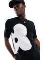 ASOS DESIGN - T-shirt in maglia nera con fiore bianco-Nero